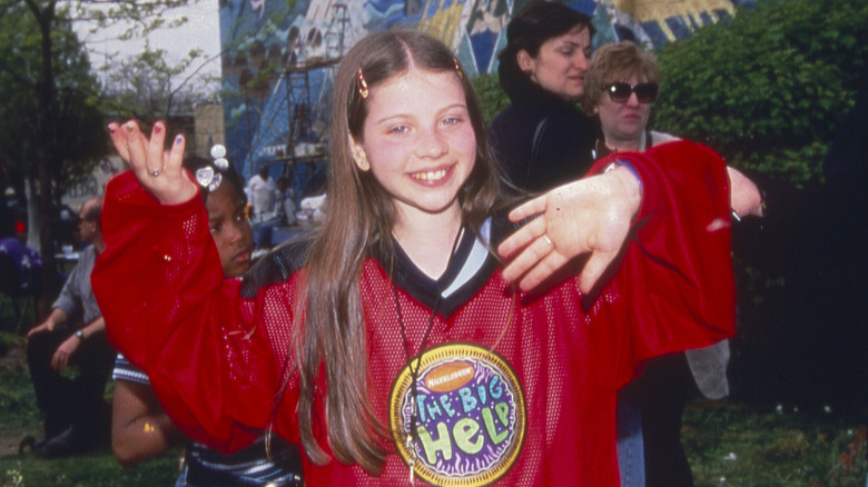 Young Michelle Trachtenberg smiling