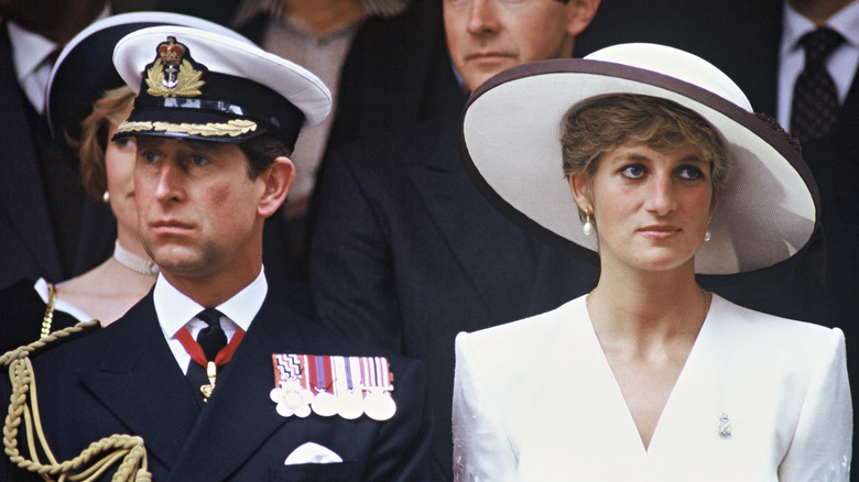 Prince Charles sitting with Princess Diana