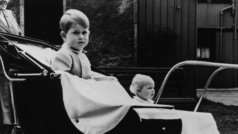 Young King Charles sitting in a pram