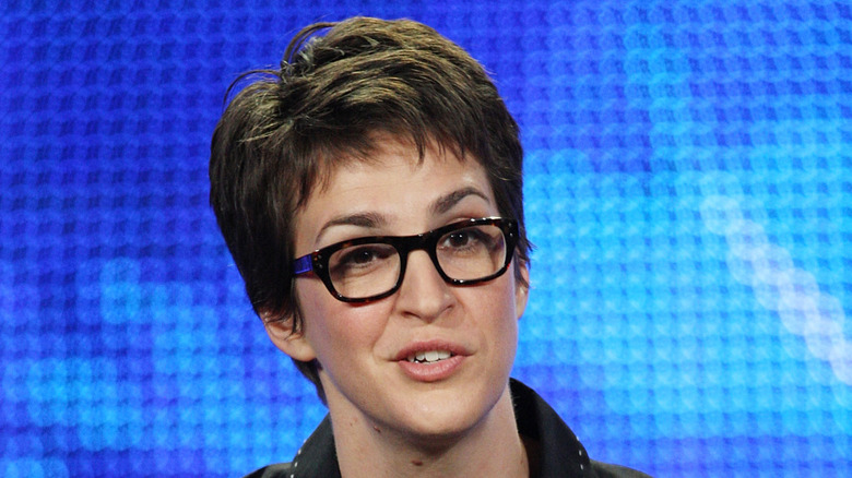 Rachel Maddow in front of a blue background at the TCA press tour