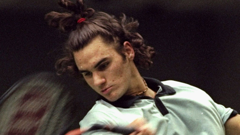 Young Federer with long hair