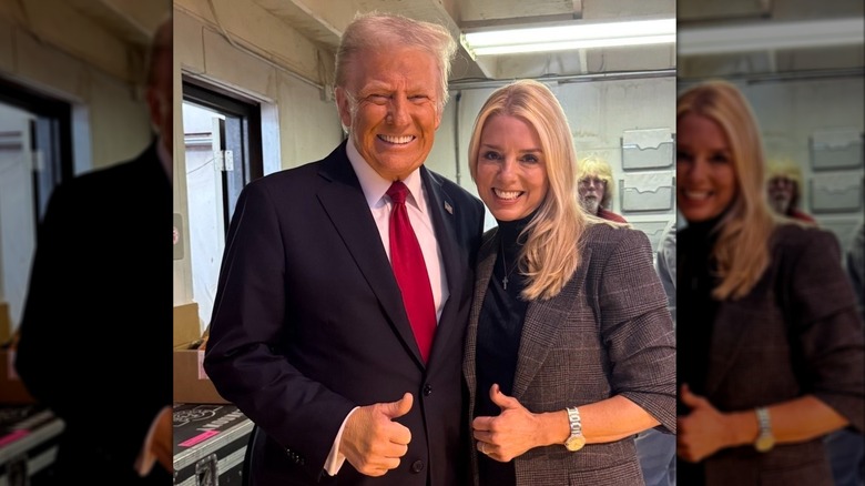 Pam Bondi gives a thumbs up alongside President Trump