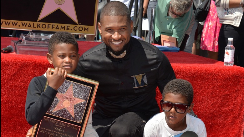 Usher with his sons on The Walk Of Fame 