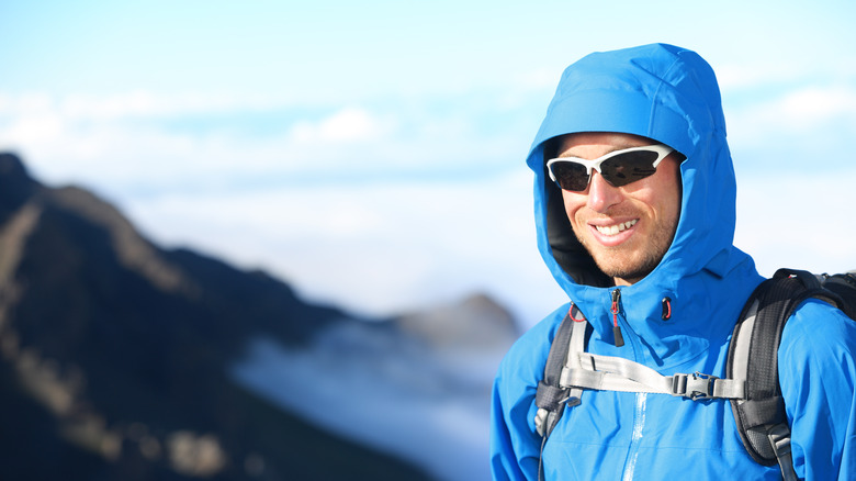 man wearing sunglasses smiling