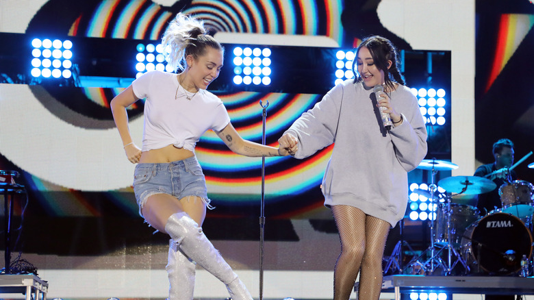 Miley and Noah Cyrus performing together 