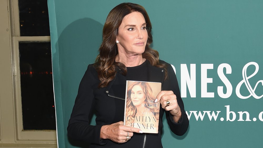 Caitlyn Jenner holding her book at Barnes & Noble