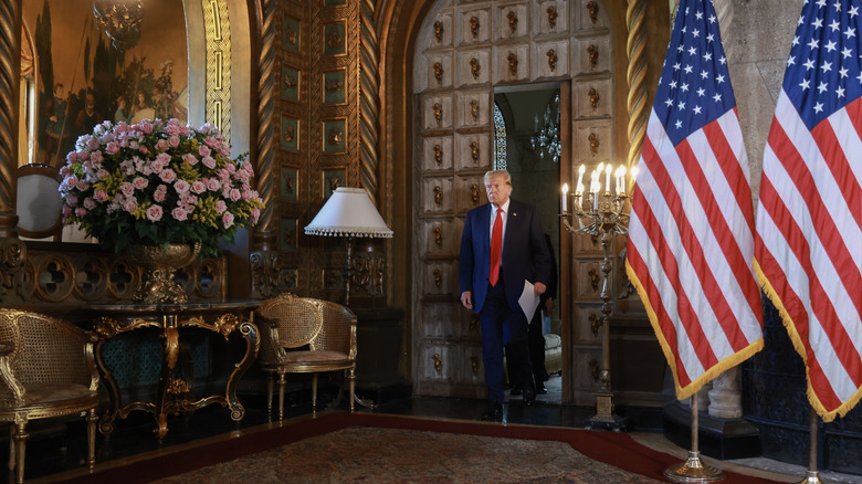 Donald Trump walking into Mar-a-Lago