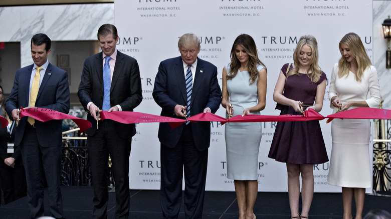 Trump family cutting ribbon