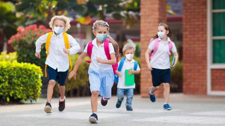 Mashed children running at school