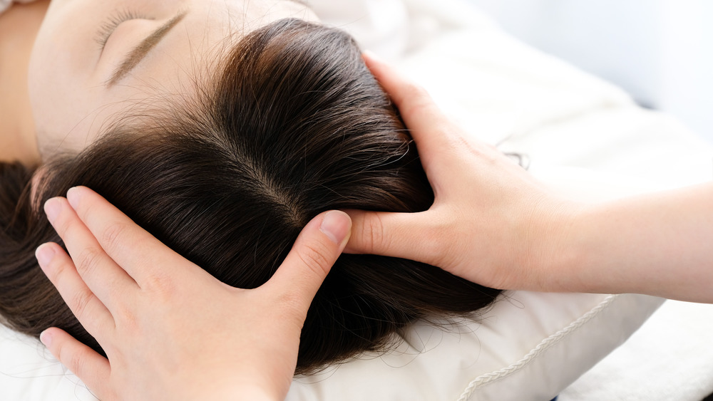 Woman receiving an acupressure treatment