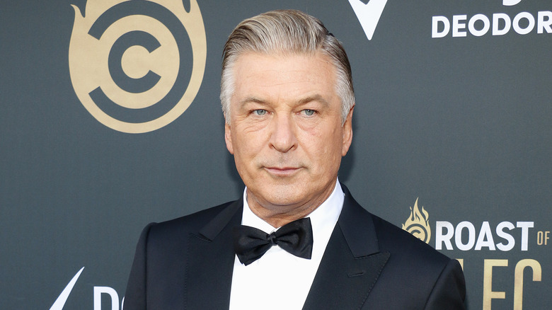 Alec Baldwin wears a black bowtie and matching jacket.