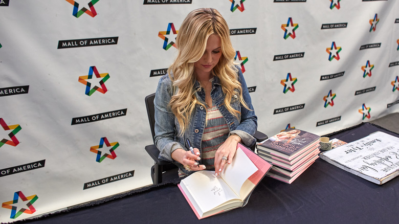 Emily Maynard Johnson signing books