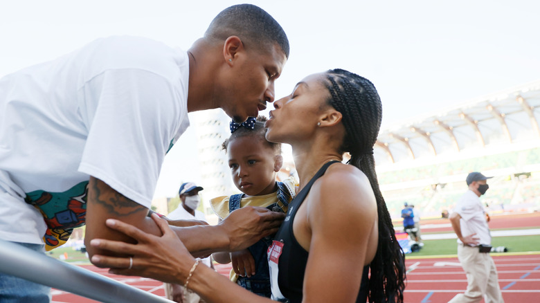 Allyson Felix gets a kiss from husband Kenneth