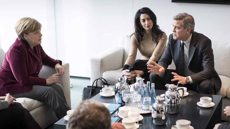 Amal and George Clooney in a meeting