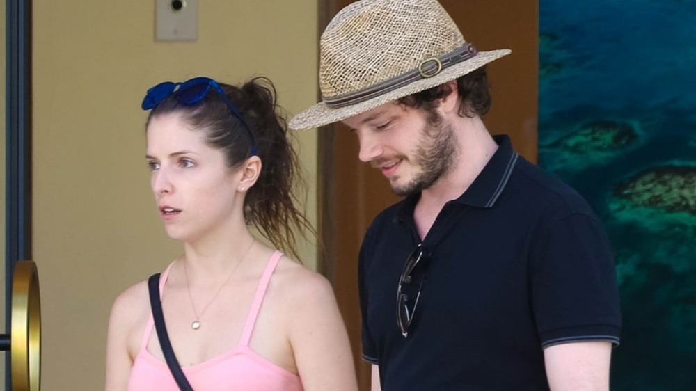 Ben Richardson and Anna Kendrick exiting a building