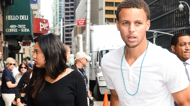 Ayesha Curry and Stephen Curry walk