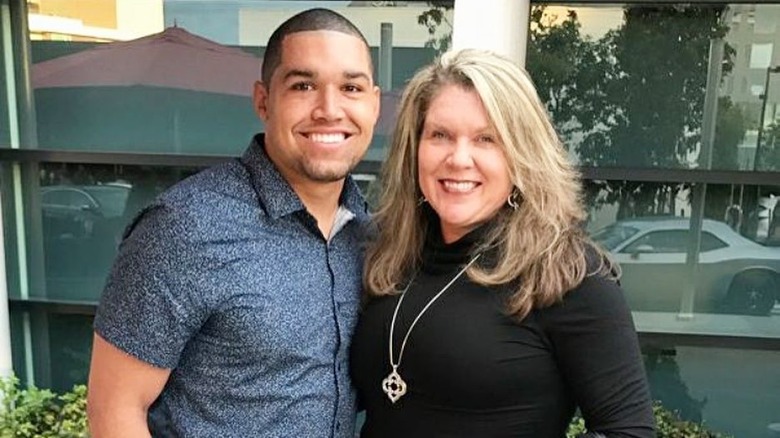 Rodney Mathews posing with his mom