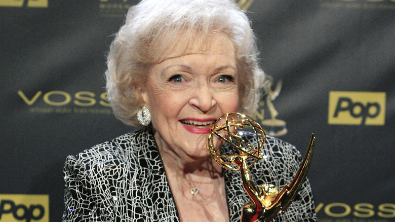 Betty White holding Emmy award