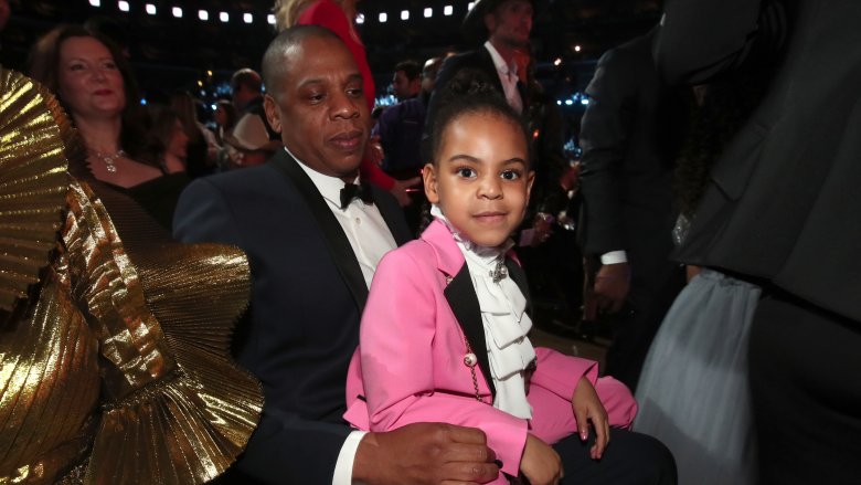 Blue Ivy on her father's lap