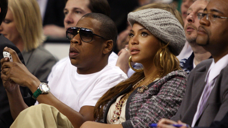 Jay-Z and Beyoncé watching a game