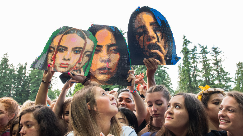 Fans of Billie Eilish holding signs in 2019