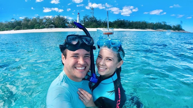 Chandler Powell and Bindi Irwin snorkling