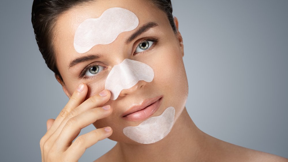 woman using blackhead pore strips