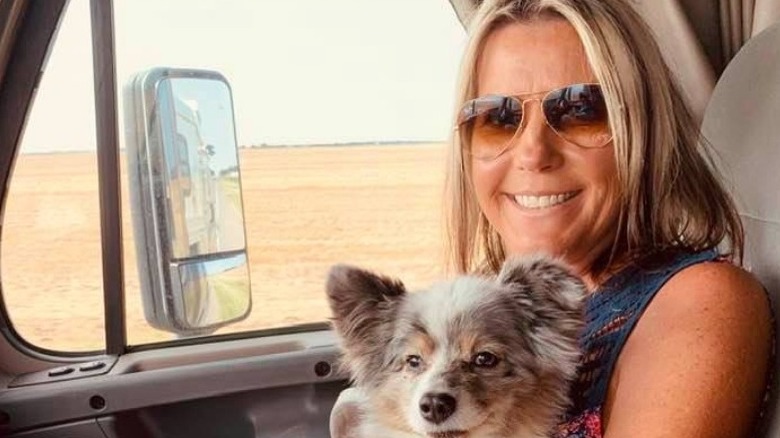 Kaynette Scheck smiling with dog 