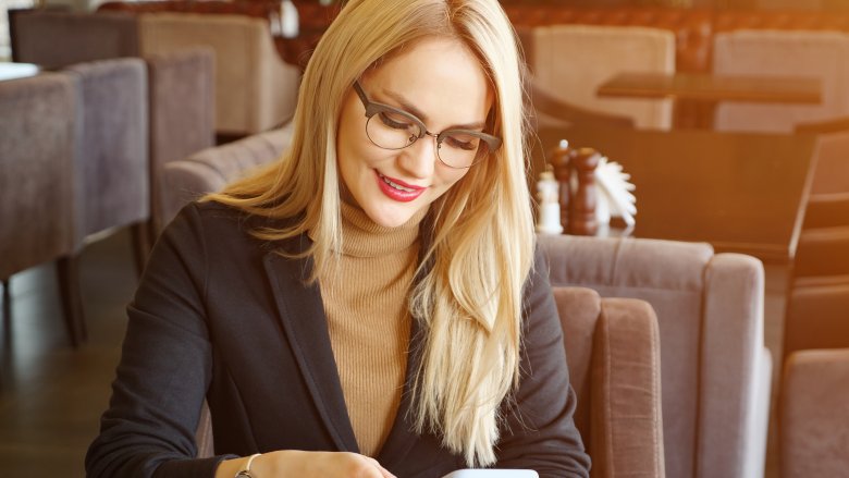 Smart blonde woman with glasses