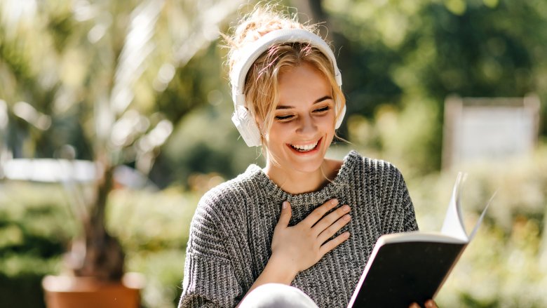 Smart blonde woman with book