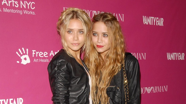 Mary-Kate & Ashley Olsen posing