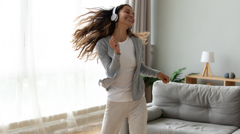 Woman dancing in living room