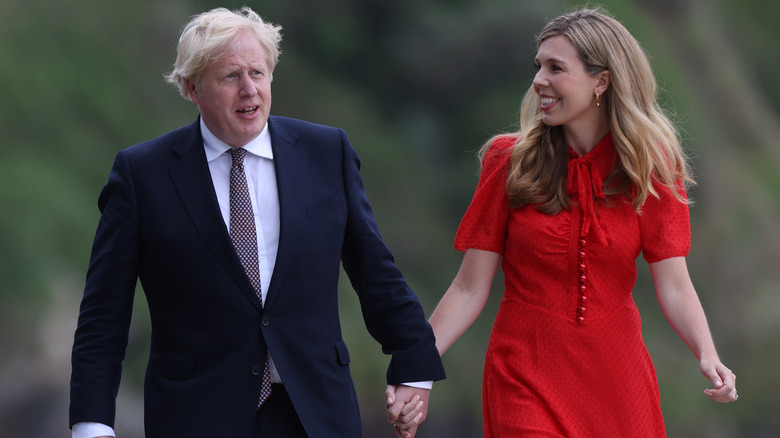 Boris, Carrie Johnson walking, holding hands