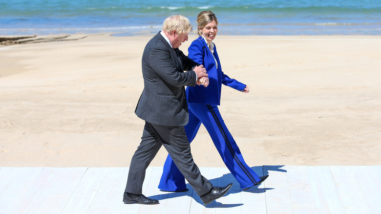 Boris, Carrie Johnson walking by beach