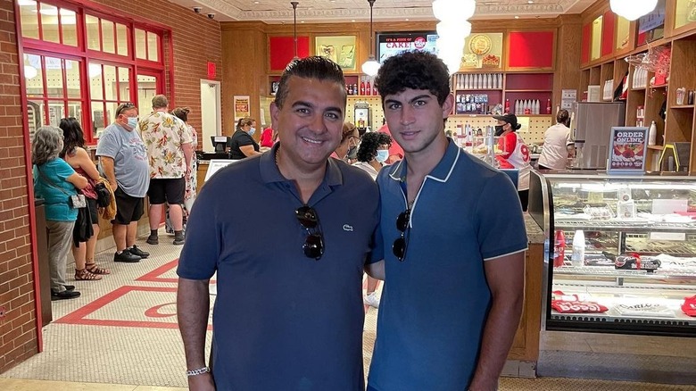 Buddy Valastro Jr. posing with his dad