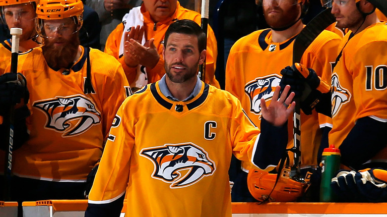 Mike Fisher on the ice in a team jersey 