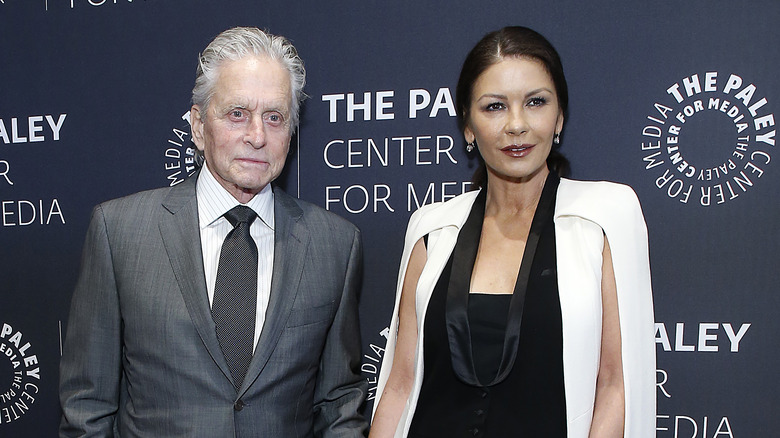 Catherine Zeta-Jones and Michael Douglas standing