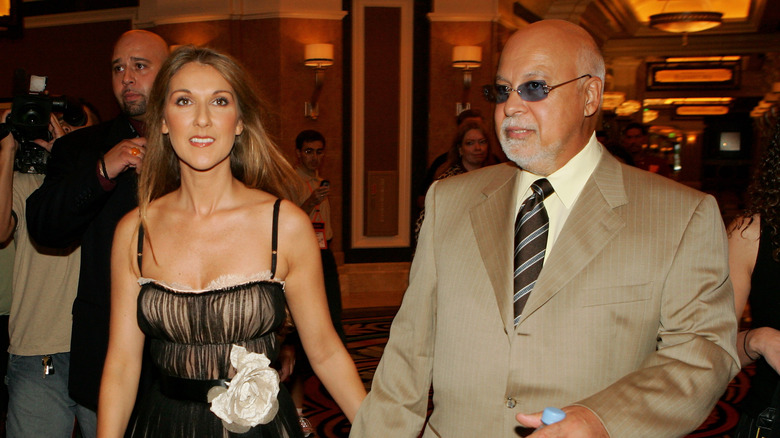 Celine Dion and Rene Angelil walking   