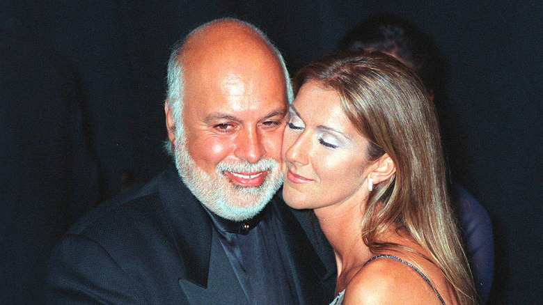 Celine Dion and Rene Angelil posing  