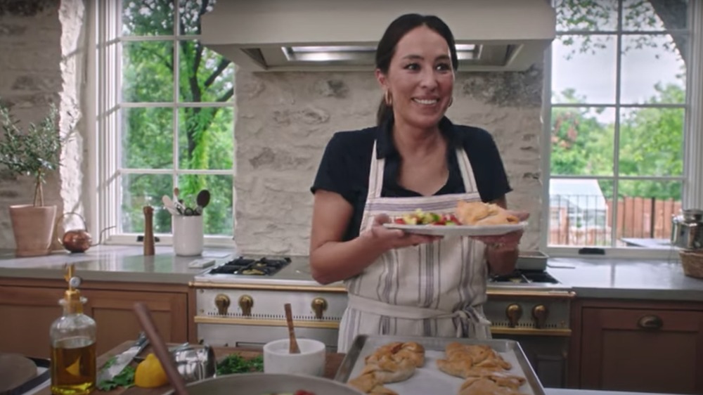 Joanna Gaines holding a plate of food
