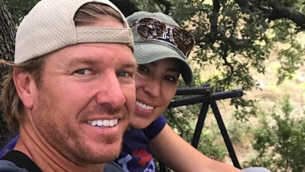 Chip and Joanna Gaines in front of a tree