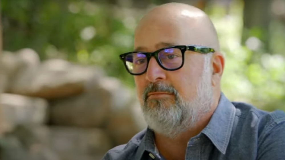 Andrew Zimmern wearing glasses