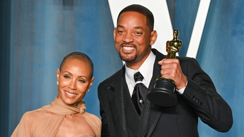 Will Smith and Jada Pinkett-Smith pose together at an Oscars afterparty