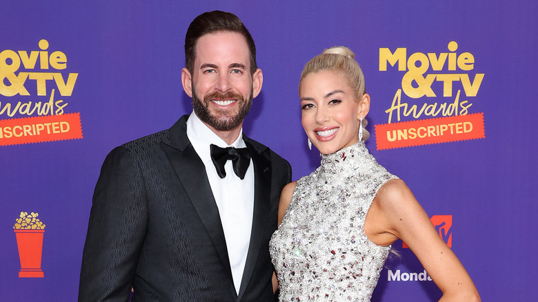 Heather Rae Young and Tarek El Moussa posing on the red carpet