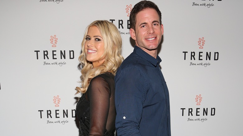 Christina Haack and Tarek El Moussa standing back-to-back