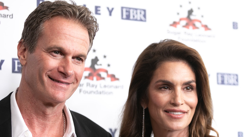 Rande Gerber, Cindy Crawford smiling, posing 