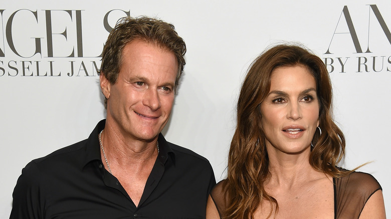 Rande Gerber, Cindy Crawford smiling, posing