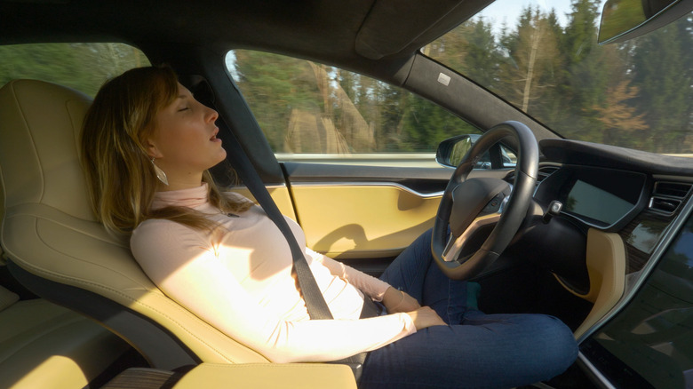 woman napping in car