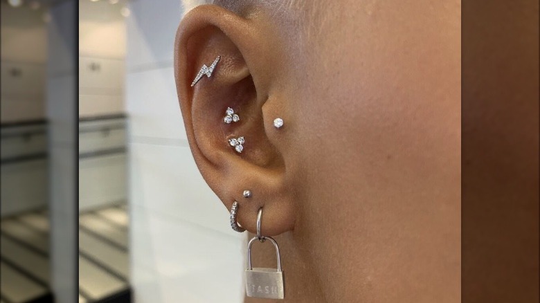 Two conch piercings