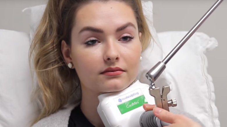 A woman having her chin CoolSculpted